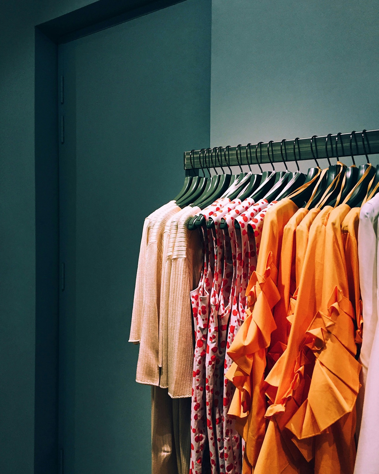 A spectrum of garments on hangers