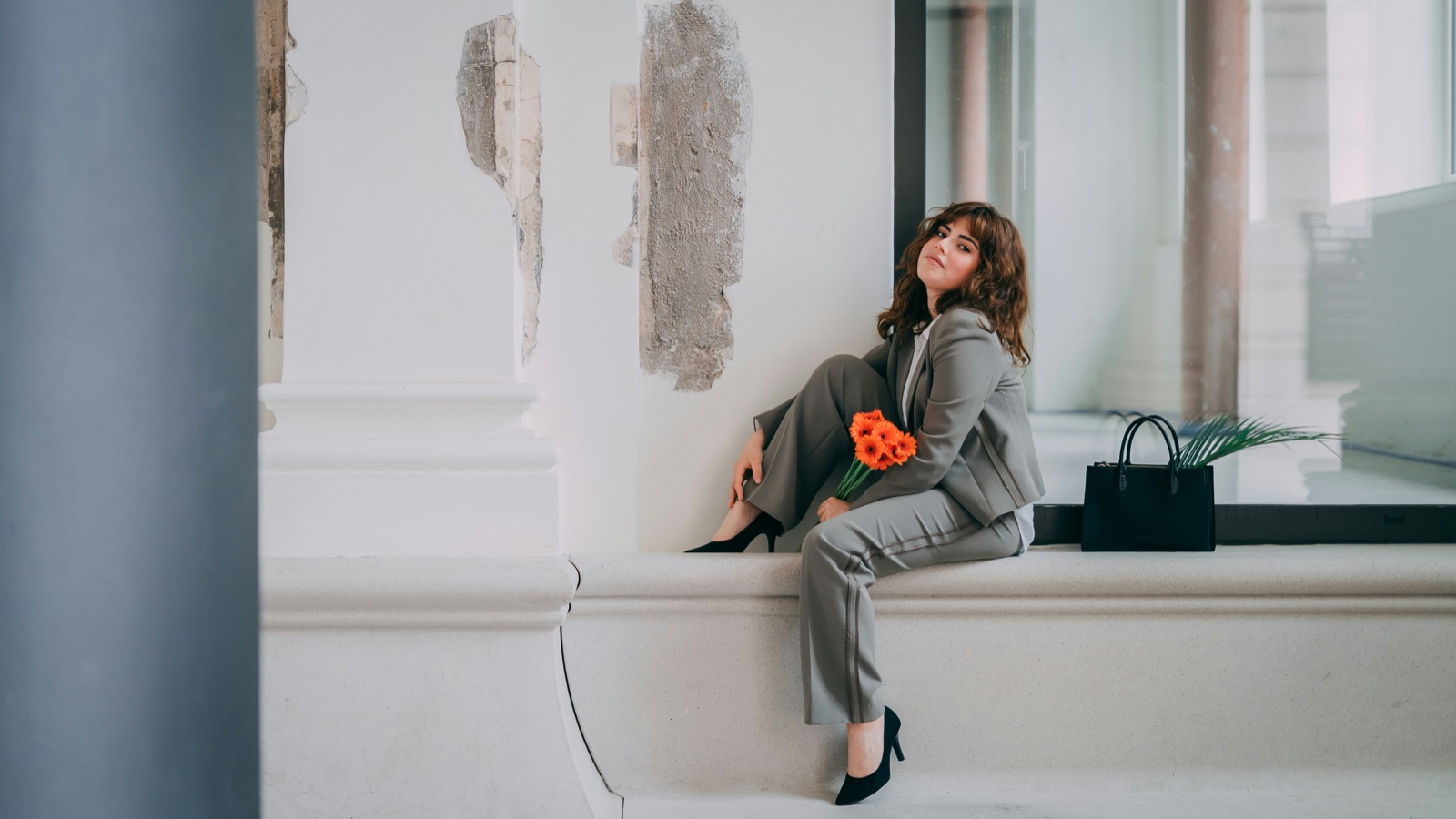 A portrait in a grey suit